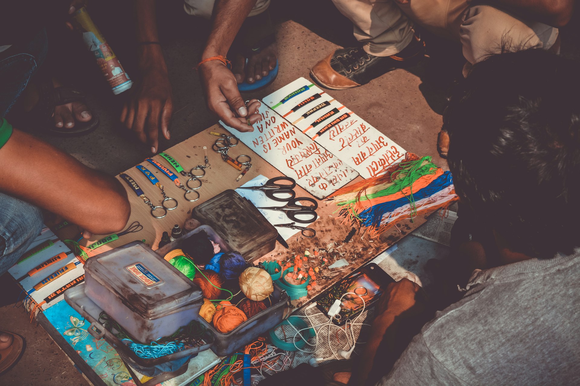 group of people making keychains